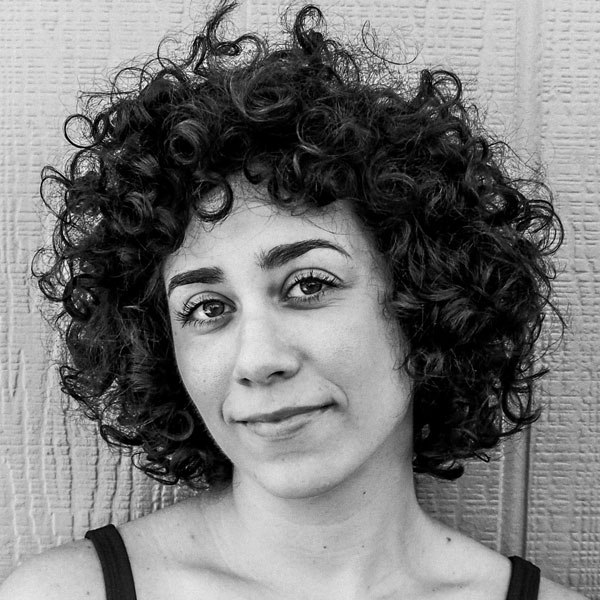 Black and white headshot of Alex
